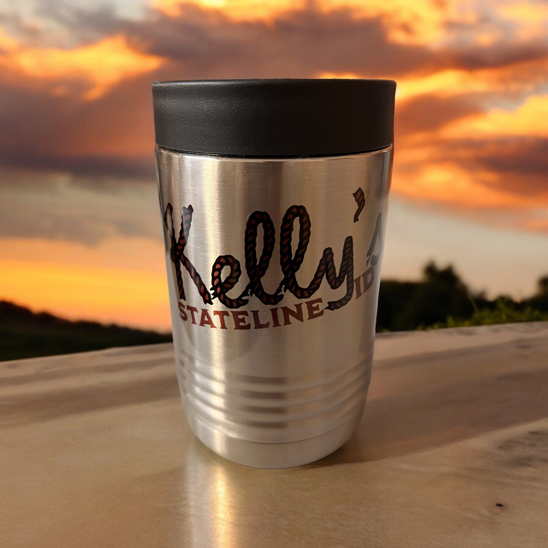 Image of the Kelly Hughes Stateline ID Beverage Holder, featuring a sleek design with the band's logo and an ID slot, perfect for keeping drinks cool at concerts and festivals while enjoying the music.