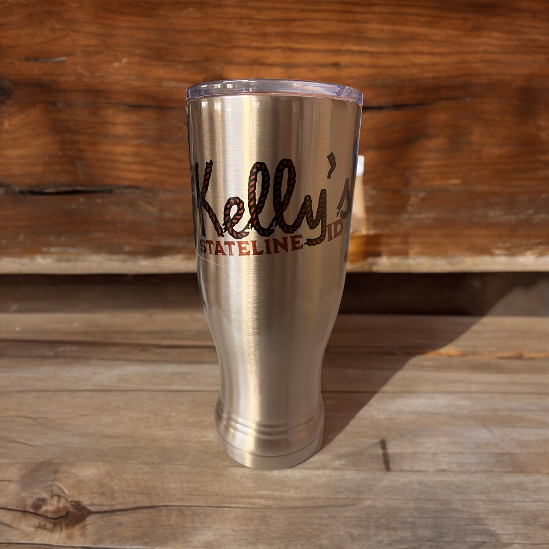 Image of the Kelly Hughes Stateline ID Pilsner, featuring a sleek design with the band's logo and an integrated ID slot, perfect for sipping in style at events while keeping track of your glass.