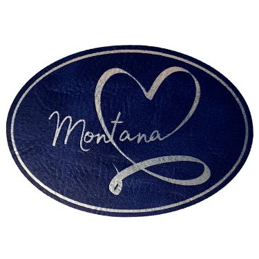 A striking oval patch in blue and silver, symbolizing love for Montana's natural beauty and heritage.