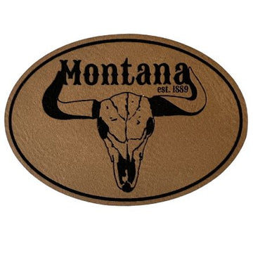 A light brown oval patch adorned with a Montana steer silhouette, perfect for showcasing love for the Treasure State.