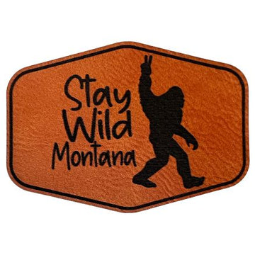 A rawhide hexagon-shaped patch with "Stay Wild Montana" inscription.