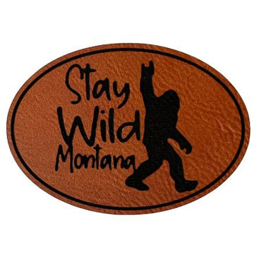 A rawhide oval patch with "Stay Wild Montana" inscription.