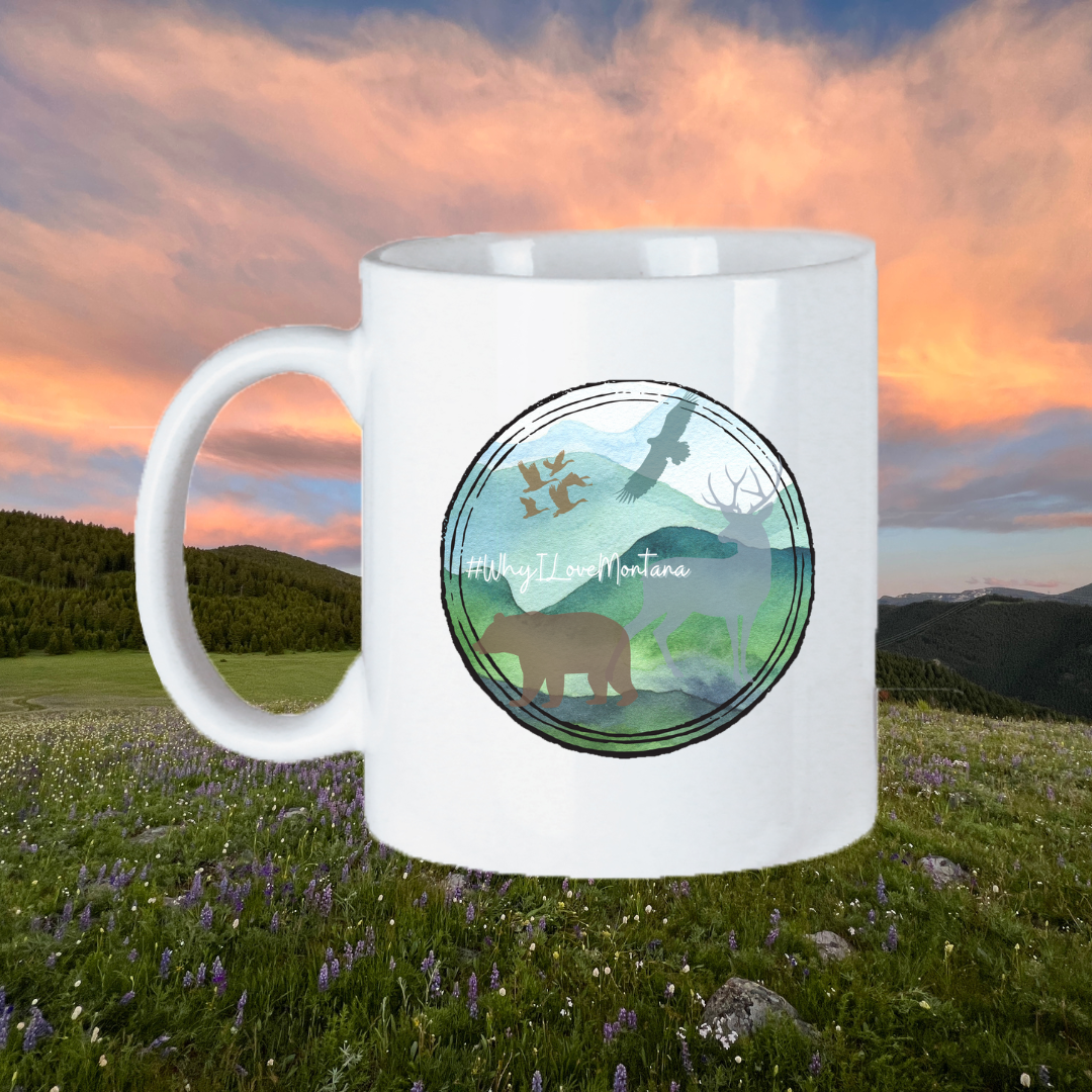  Image of the 11oz Montana Scene Mug, featuring a stunning depiction of Montana's landscapes and wildlife, perfect for those who appreciate the beauty of the state to enjoy their drink while immersed in its natural wonders.