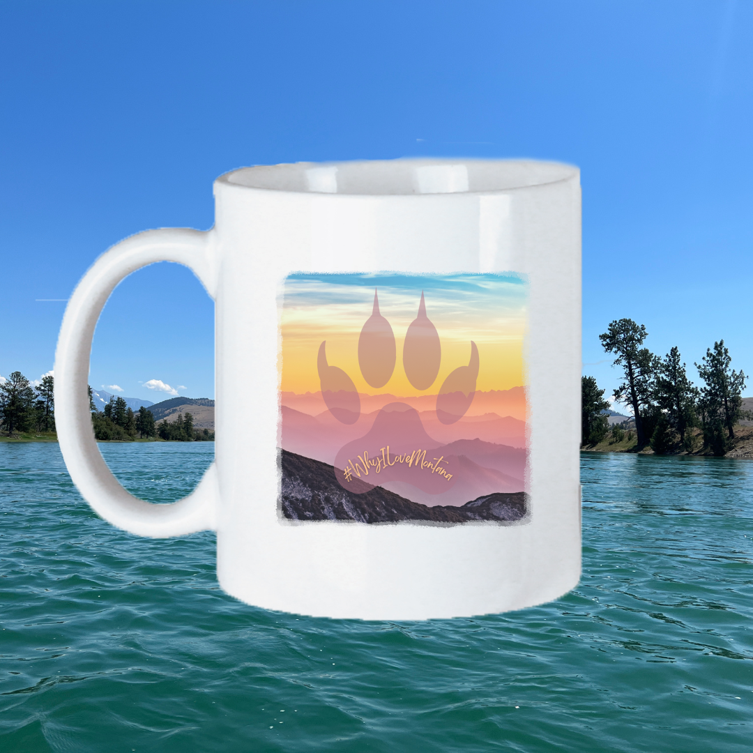 Image of the 11oz Bear Paw Sunrise Above the Mountains Mug, featuring a picturesque sunrise scene above the mountains, perfect for nature lovers to enjoy their morning beverage.