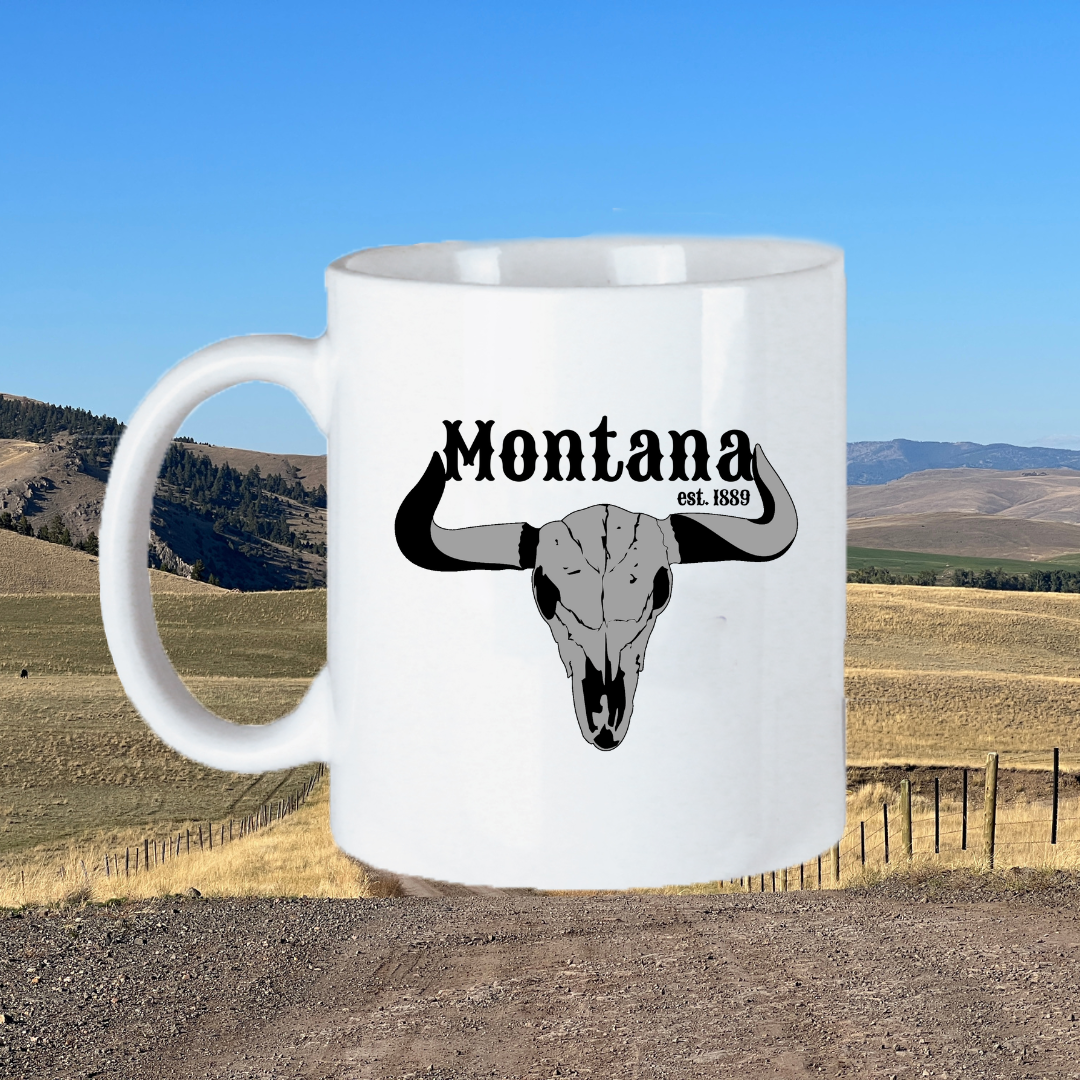  Image of the 11oz Montana Steer Mug, featuring the silhouette of a steer against a rustic background, perfect for those who appreciate the heritage and culture of the American West to enjoy their drink with a touch of Montana flair.