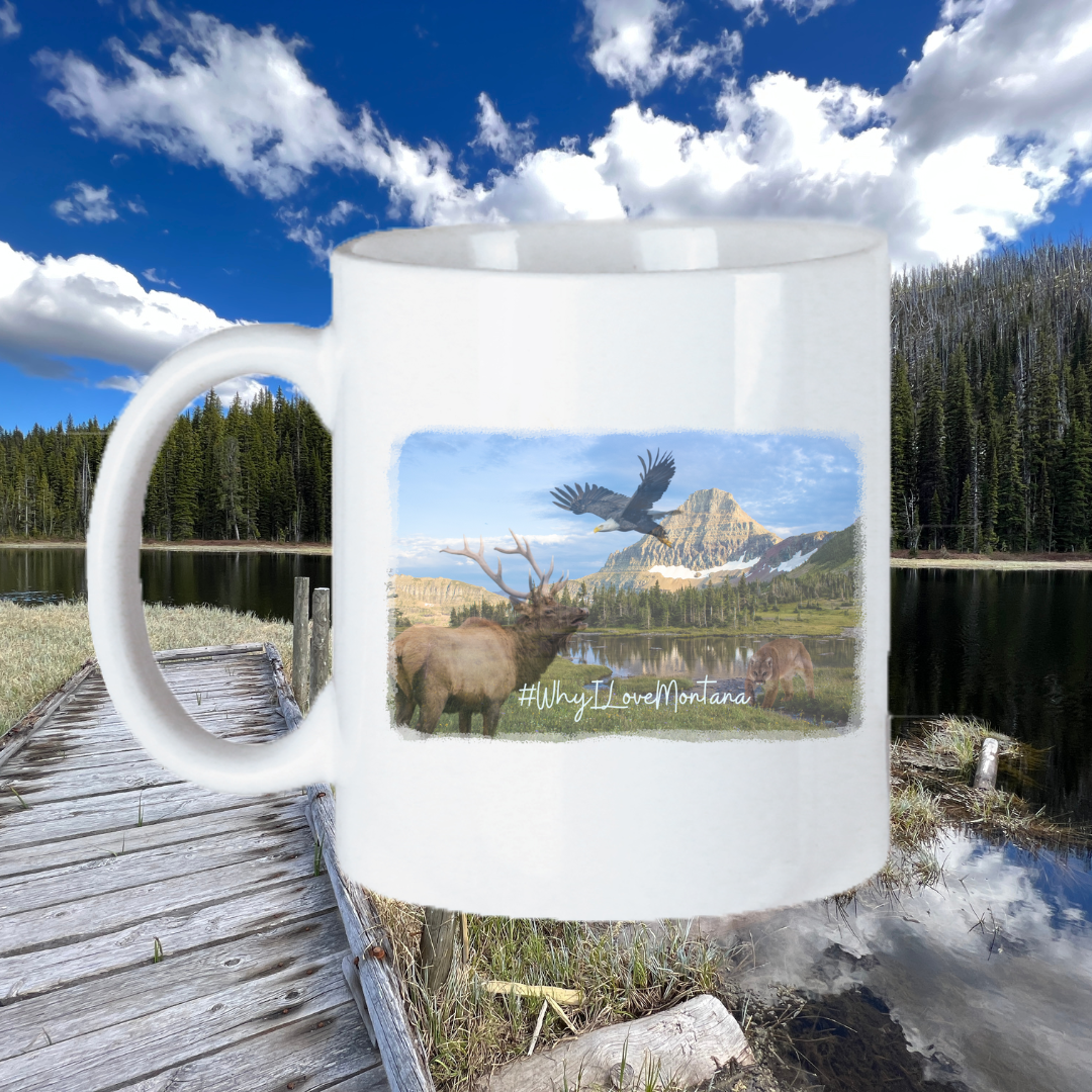Image of the 11oz Montana Wildlife Scene Mug, featuring an intricately detailed depiction of Montana's diverse fauna against a scenic backdrop, perfect for nature enthusiasts to enjoy their drink while appreciating the state's natural beauty and wildlife.
