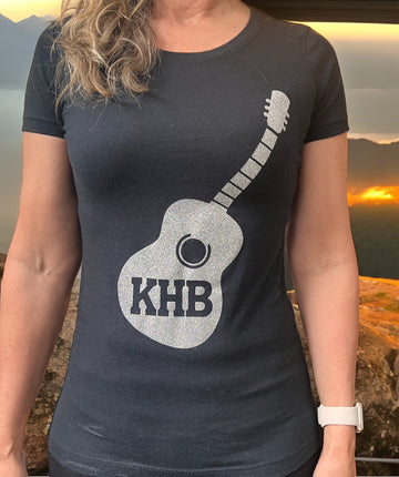 Image of the Kelly Hughes Band Sparkle Tee, featuring a glittery "Sparkle" slogan print, perfect for adding some glam to your outfit and standing out in style.