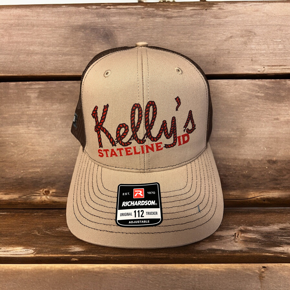 Image of Kelly's Stateline ID Cap, featuring a rugged design with the band's logo and an integrated ID slot, perfect for showcasing style and convenience at events with durable construction and a comfortable fit.
