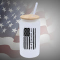  Image of the Let Freedom Ring Glass Beer Can available in frosted or clear options, featuring a bamboo lid and straw for enjoying beverages in patriotic style with added convenience.