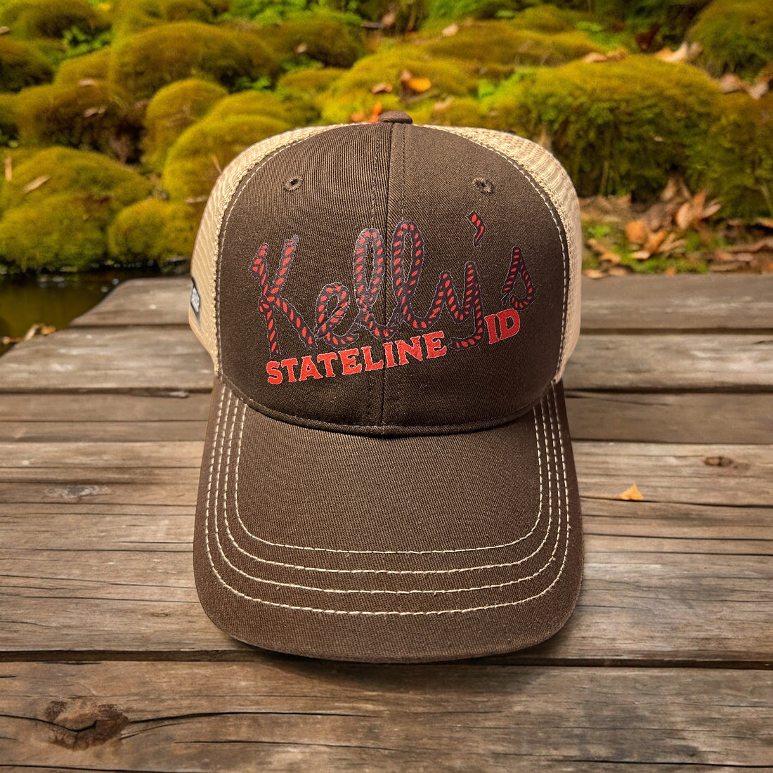 Image of the Kelly Hughes Band Signature Cap, featuring the band's embroidered logo on a classic cap, perfect for adding sophistication to any outfit.