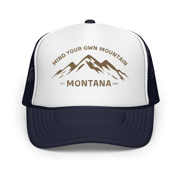Outlaw Gear Mind Your Own Mountain foam trucker hat with white front panel, navy mesh back, and mountain graphic.