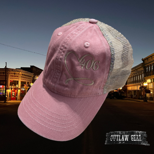  Image of the 406 Love Embroidered Dusty Pink/Floral Ponytail Hat, showcasing the iconic '406 Love' embroidery on a dusty pink hat with floral accents, perfect for adding Montana charm to your outfit.